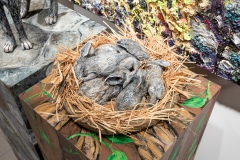 Robin Raznick, Jill and the Babes, 2022. Ceramic, acrylic paint, desert sand, raffia, and feathers, 24" x 30" x 15"