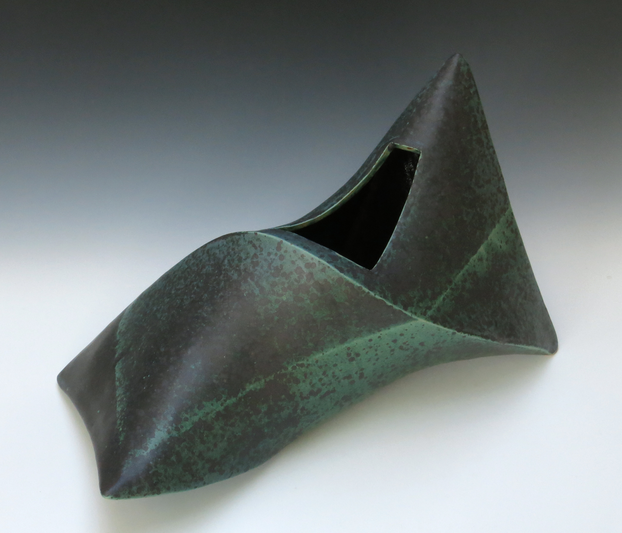 Ellen Fager, Green Container, 2023. Stoneware, thrown, assembled, and paddled, copper-green glaze, 16” x 8” x 9.5”.