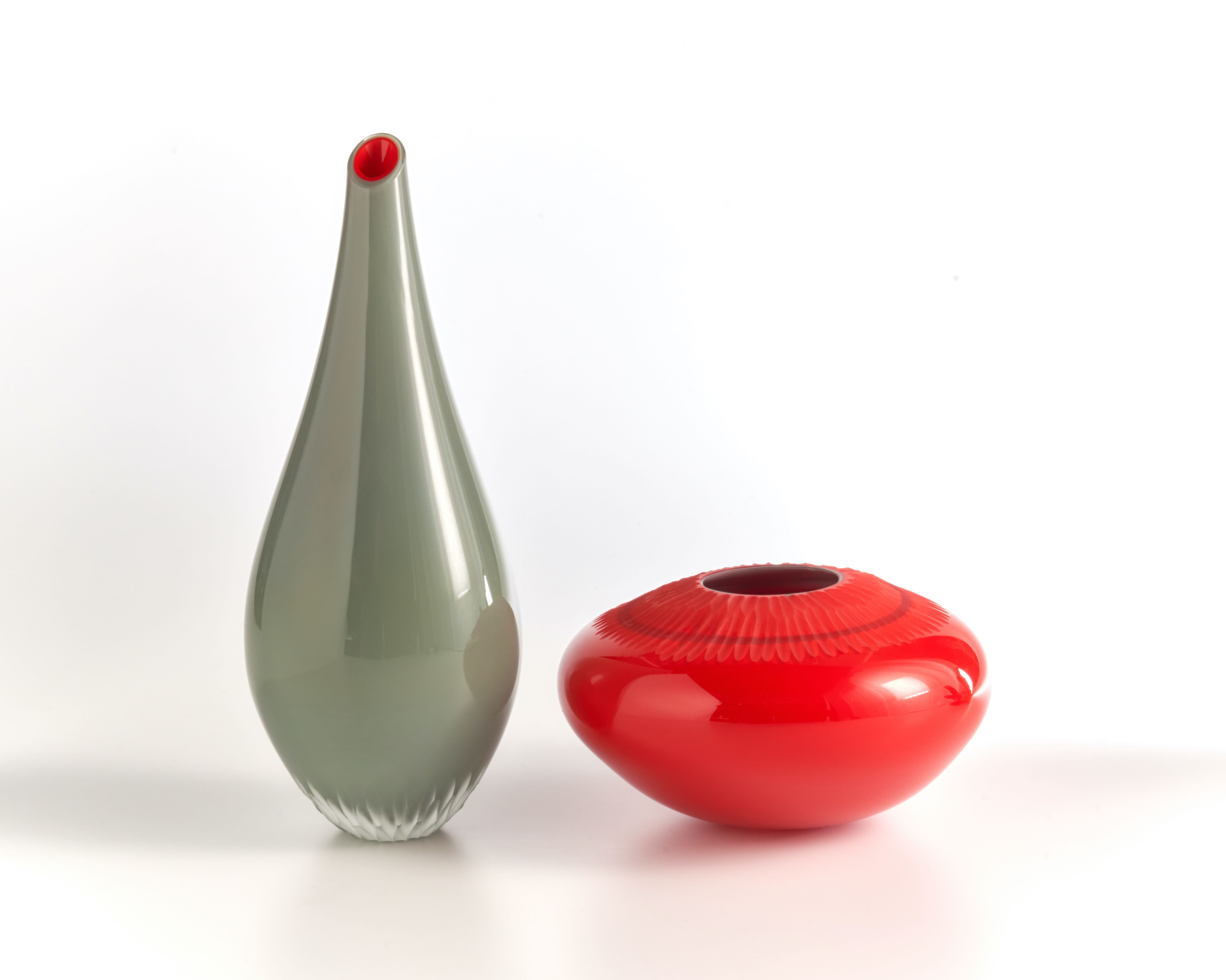 Kathleen Mitchell, Red/Gray Duo, 2022. Hand blow and carved glass, 10” x’ 12” x 5”.