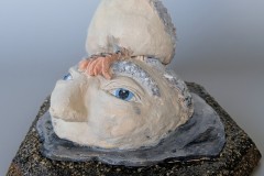 Elizabeth Marshall, Boulder Eyes, 2026. Ceramic, wood, sand, and resin, 10" x 12" x 12".