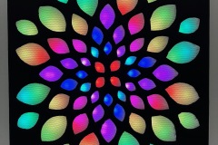 Janet Hansen, Enlighted Lotus, 2023. Animated RGB LEDs with fabric overlay, 24" x 24" x 3". $2500. Janet Hansen, Enlighted Lotus, 2023. Animated RGB LEDs with fabric overlay, 24" x 24" x 3". $2500.